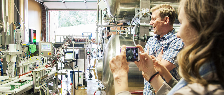 Hospitality Management student takes a photo during her internship at Sea Cider.