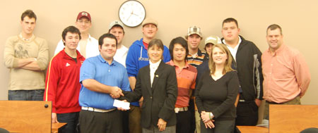 Golf Management students presenting cheque for $1,101.