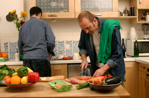 Two people preparing a meal.