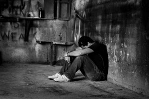 A young man depressed and alone.