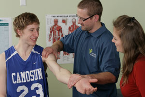 Instructor with student and patient.