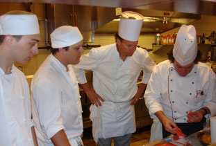 Chef de Cuisine Gilbert Noussitou and Culinary Arts students.