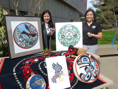 IBL students posing with auction items.