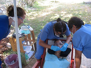 Camosun students working on child's teeth.