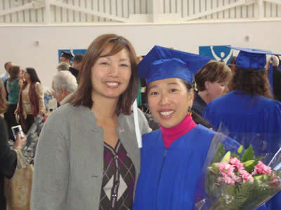 Jieny Kung at graduation ceremony, with family member Donna Shum on left