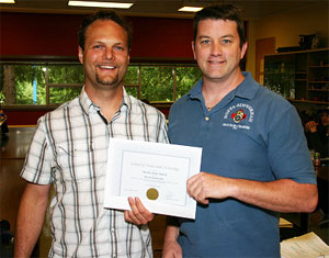 Student Kurtis Syzmczak receives Pacific Solar Award from sponsor James Smyth of Pacific Solar Smart Homes.