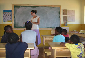 Teacher and students at the Enzigizini Informal School in Swaziland.