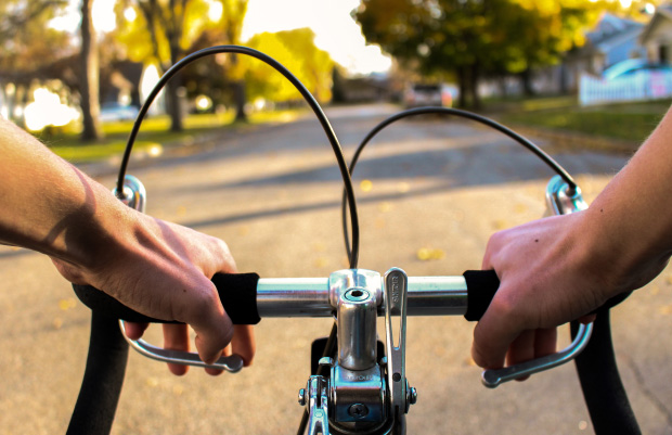 First-person view of riding a bike on a road. Image by Zienith from Pixabay